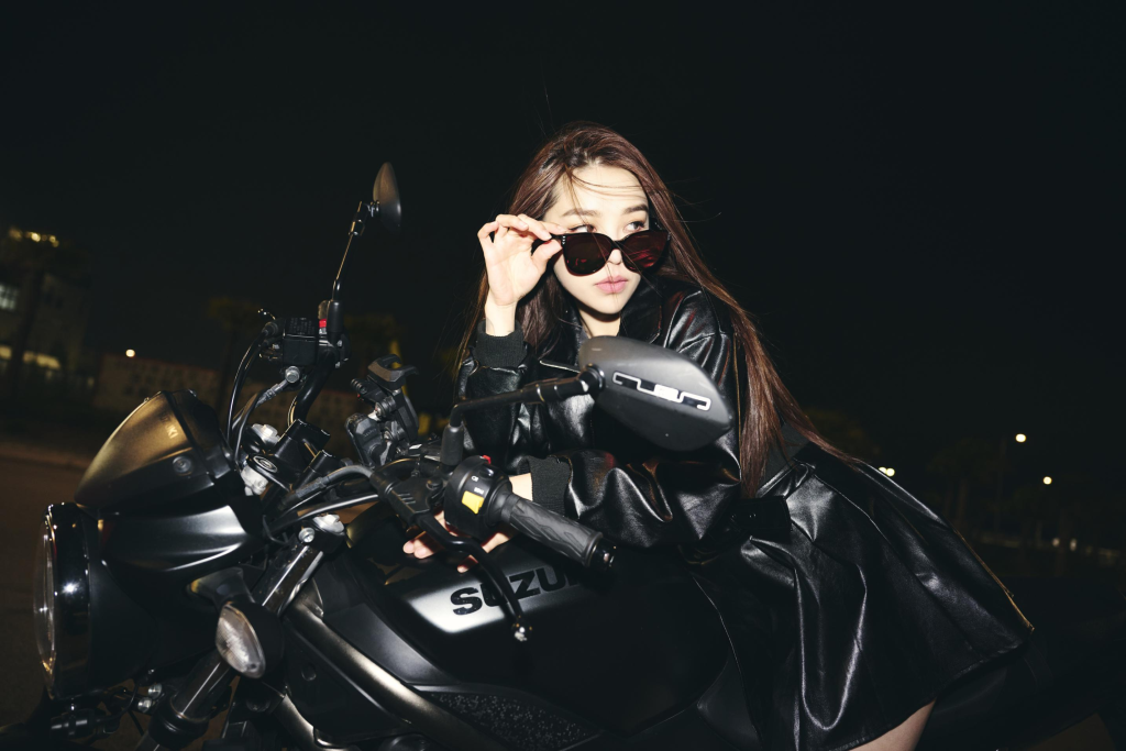 Creative outdoor fashion shoot with motorcycle