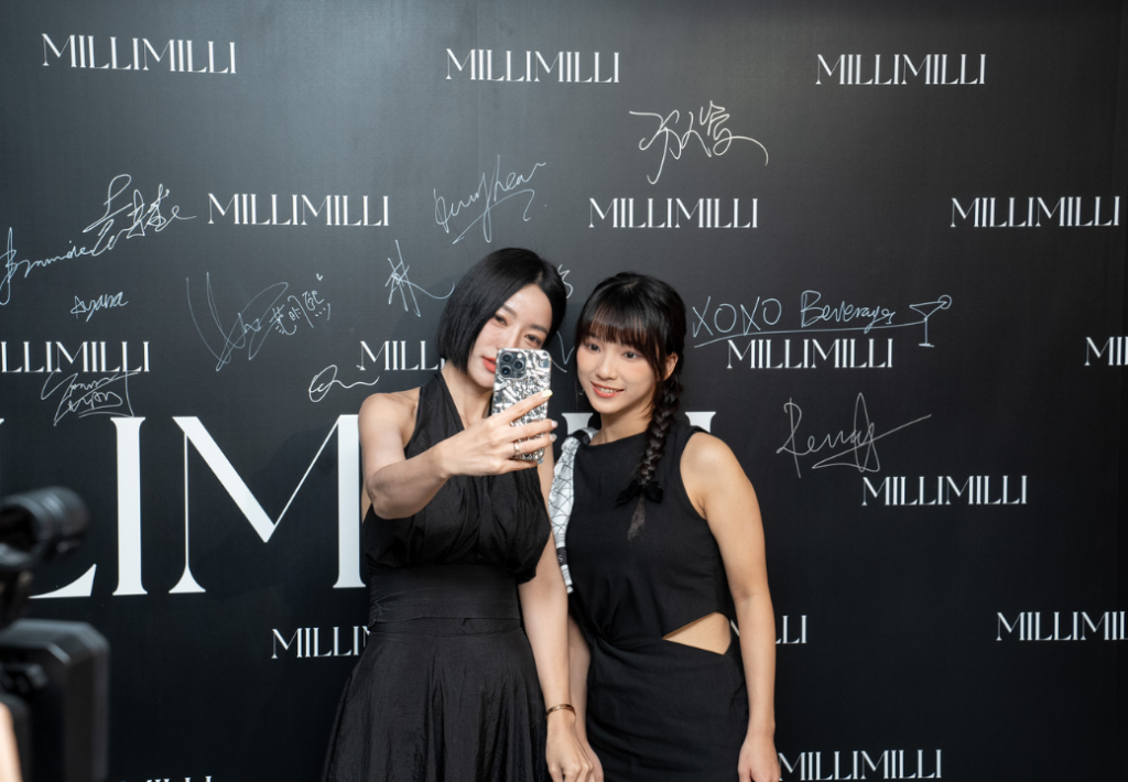 Guests taking selfies and sharing social media content at MILLIUS Co.Ltd event