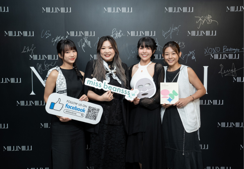 MILLIUS Co.Ltd Event_Attendees holding promotional props at launch party